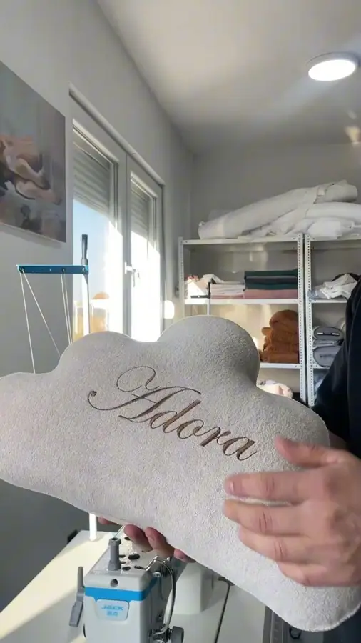 A cloud pillow with an embroidered name